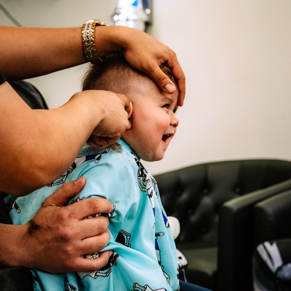 A child receiving a haircut